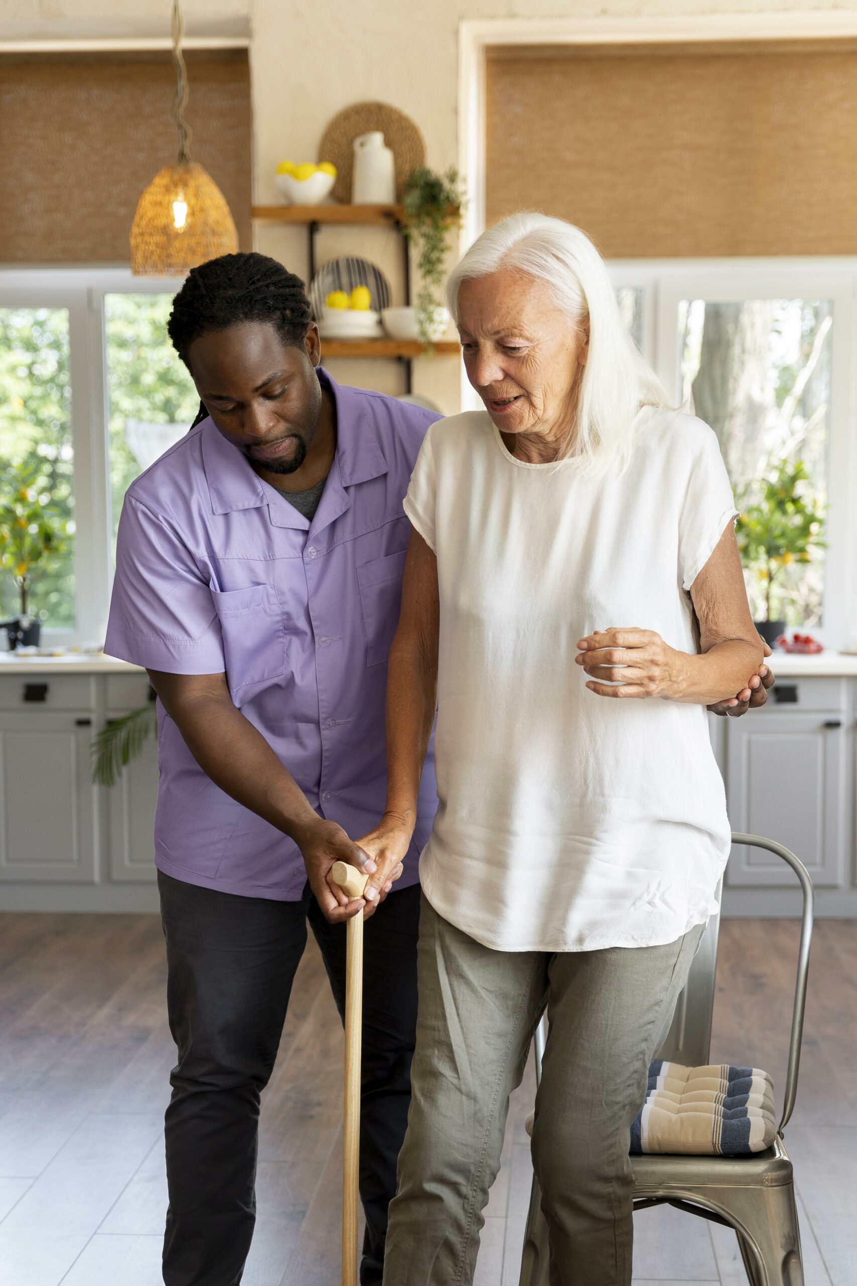 Male Social Worker Taking Care Old Woman (1)